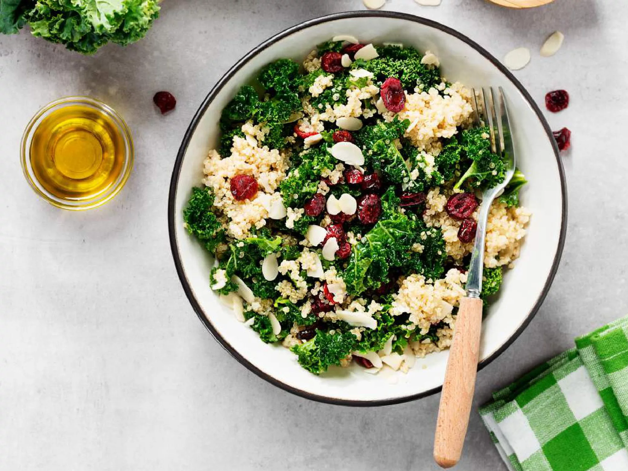 A quinoa, kale, and cranberry salad shown from above