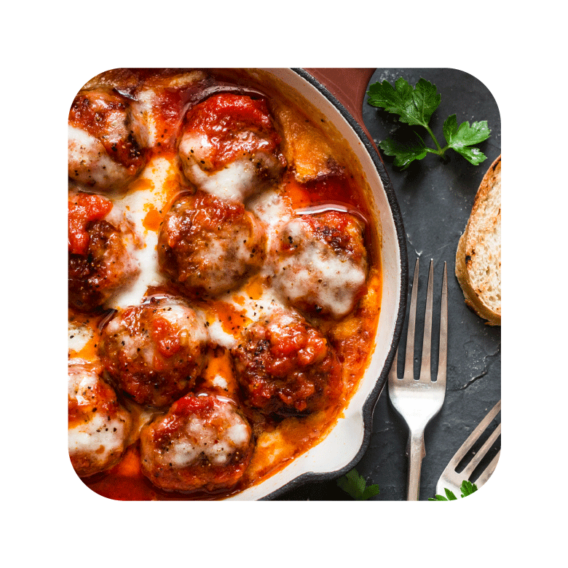 ground beef meatballs sprinkled with cheese in tomato sauce