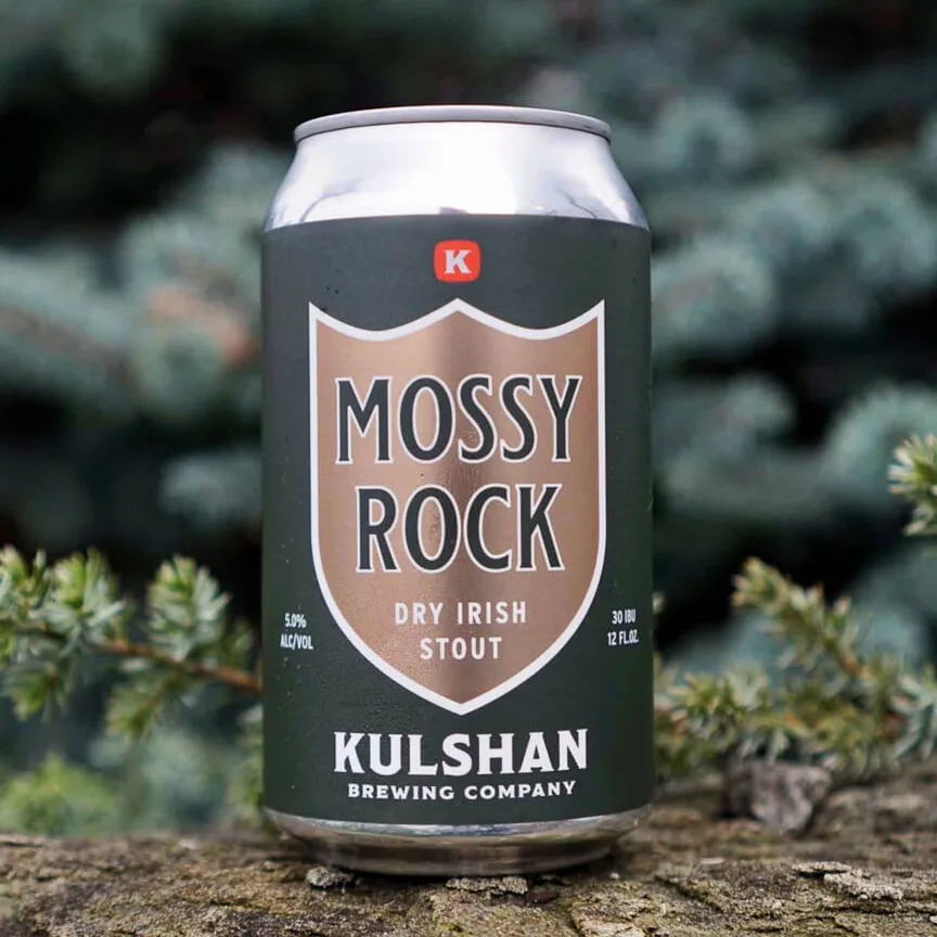 A can of Kulshan's Mossy Rock beer sits on a mossy rock.