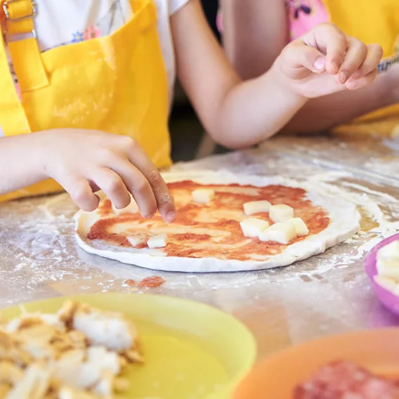 kids preparing pizza